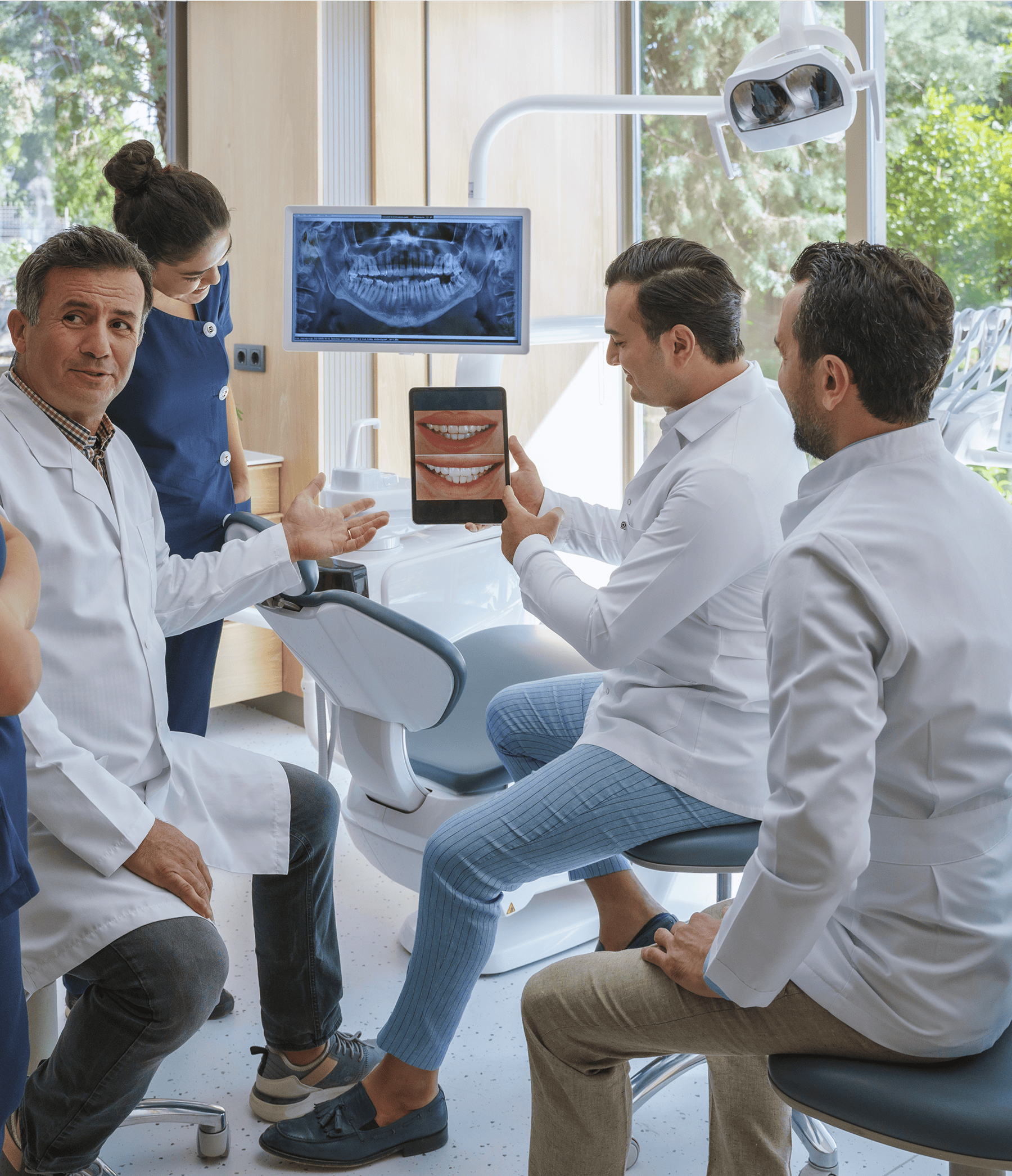 Dentists discussing dental X-ray results